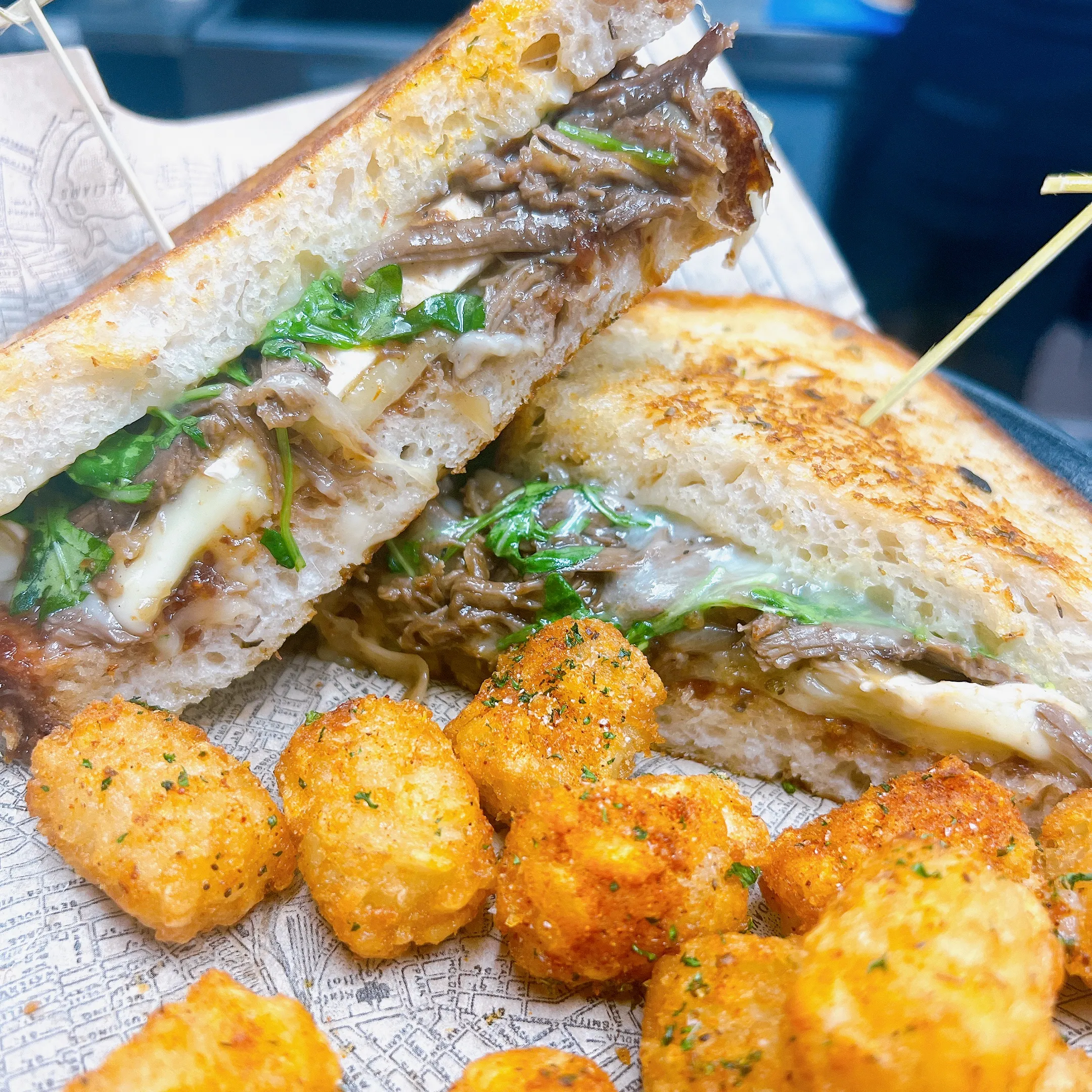 Short rib grilled cheese with rooster-spiced tots