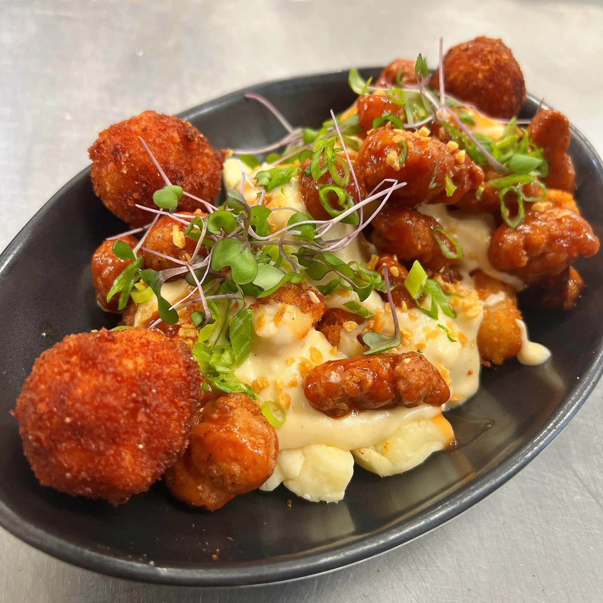 Mac & cheese poutine, crispy buffalo bites