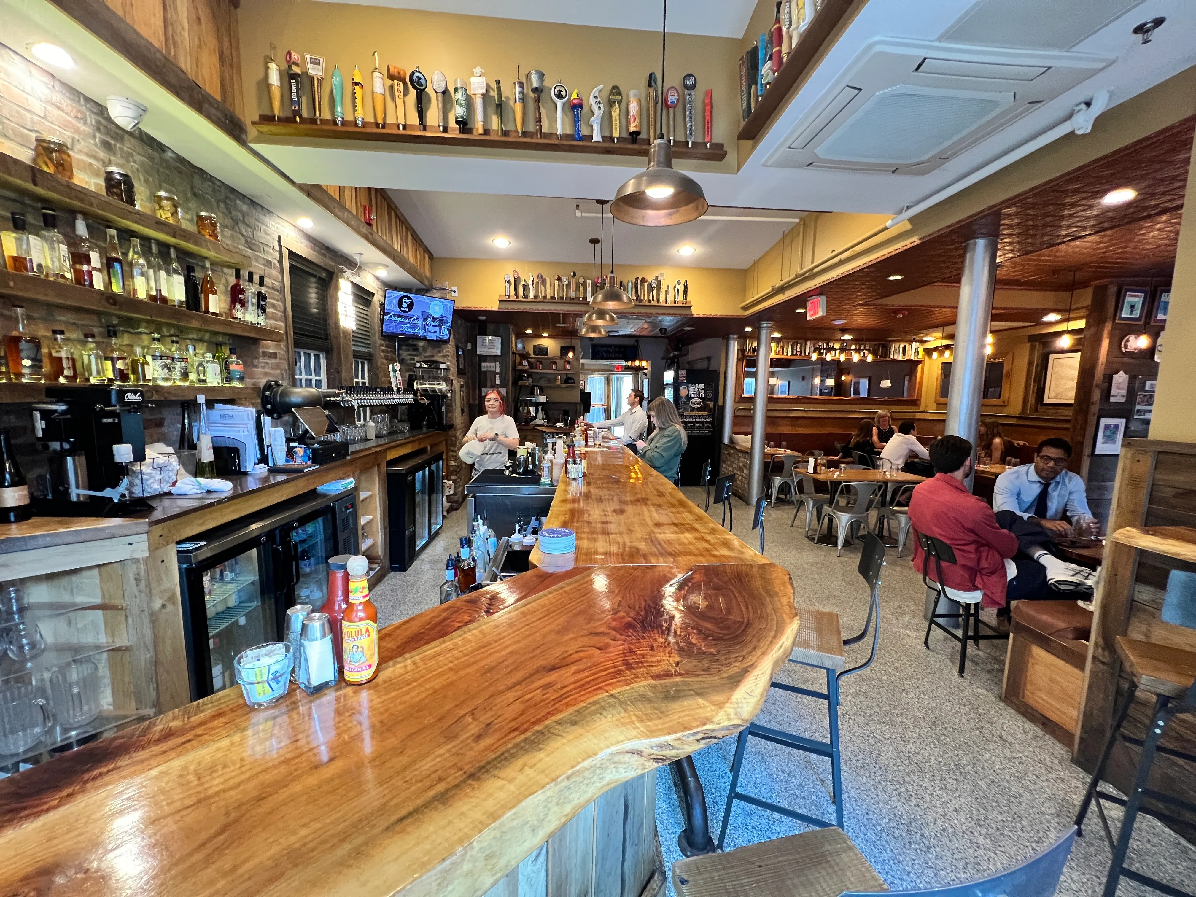 The live-edge bar, taps and all