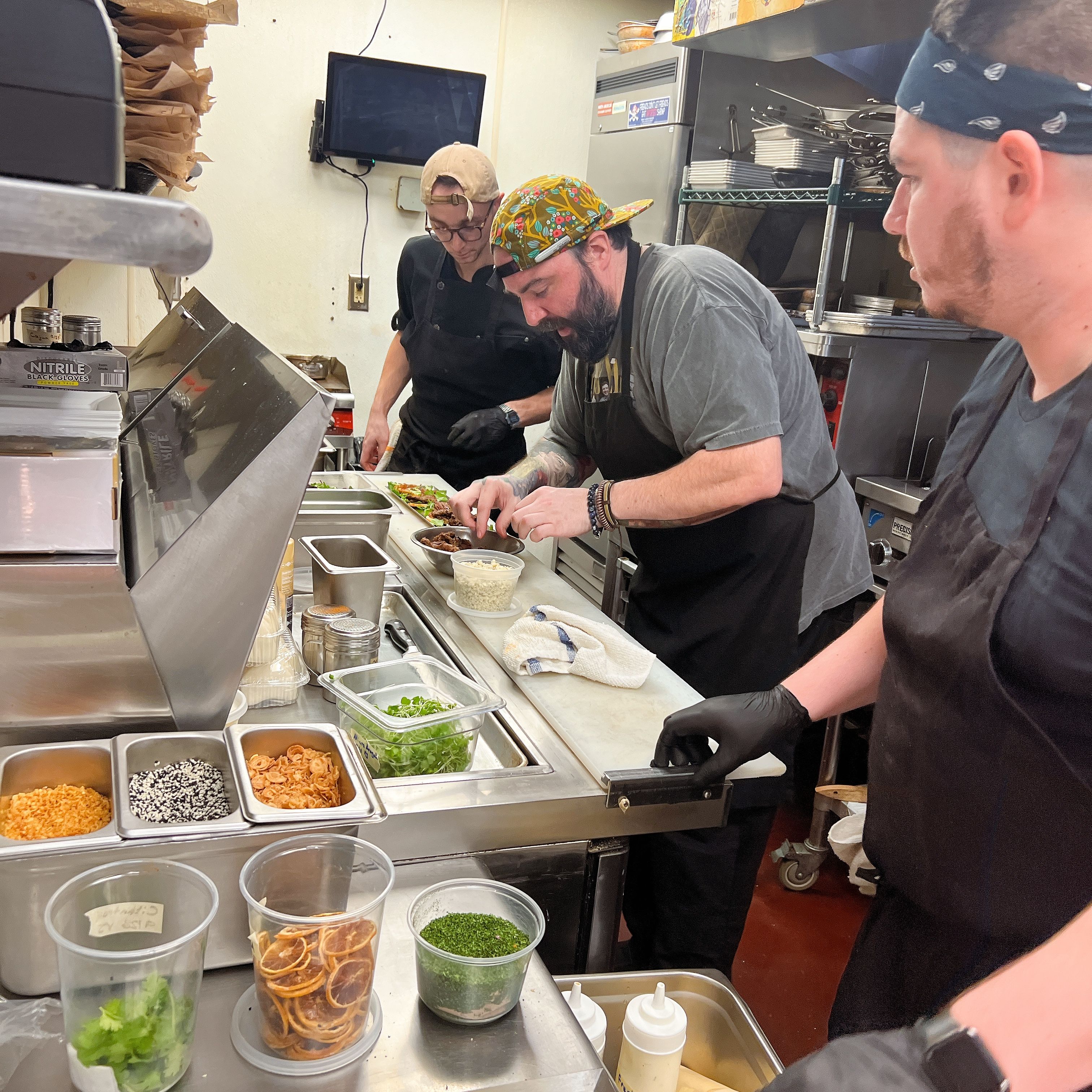 The Rogue Island kitchen team plating dishes today