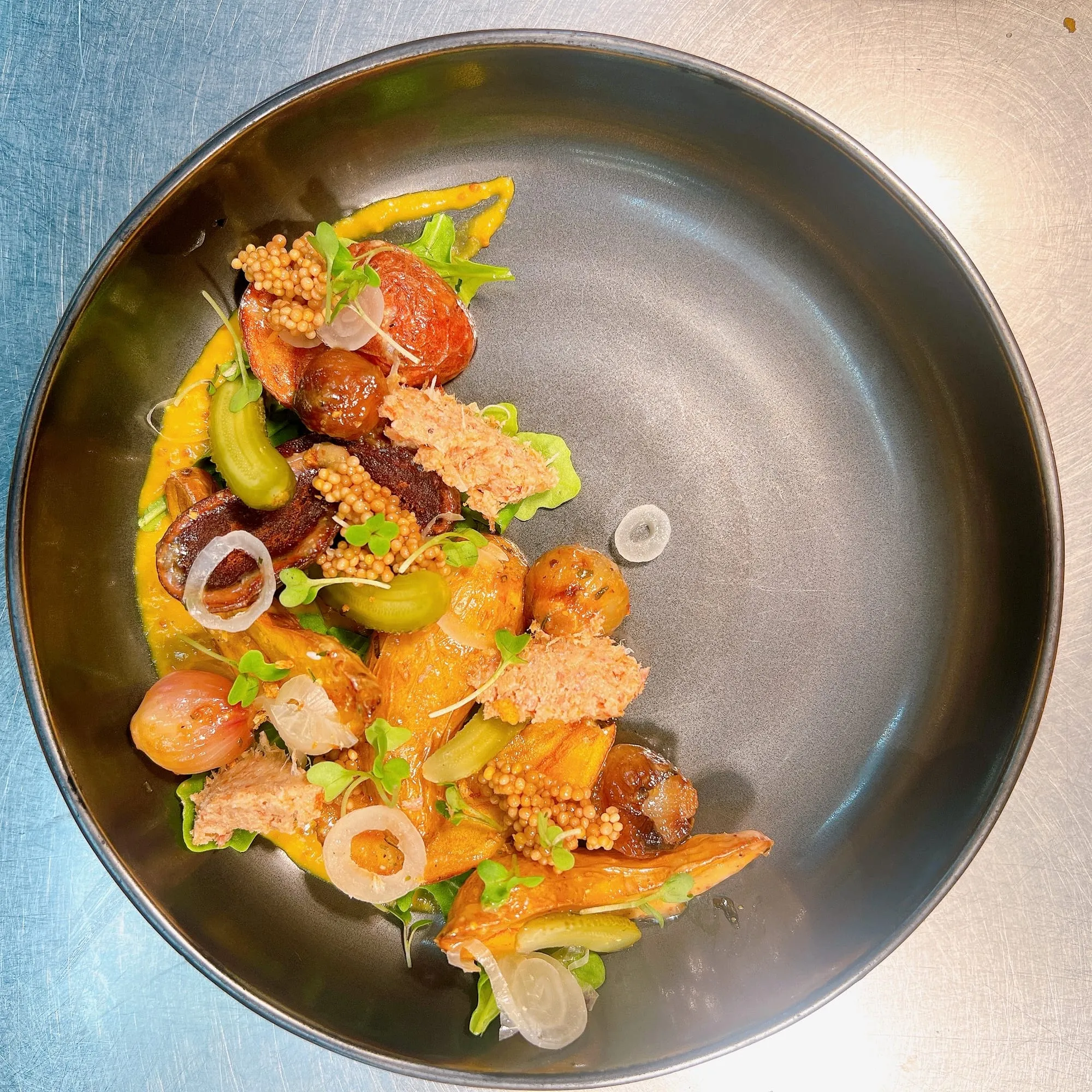 A beer-dinner course: sausage, heirloom carrots, pickled mustard seeds
