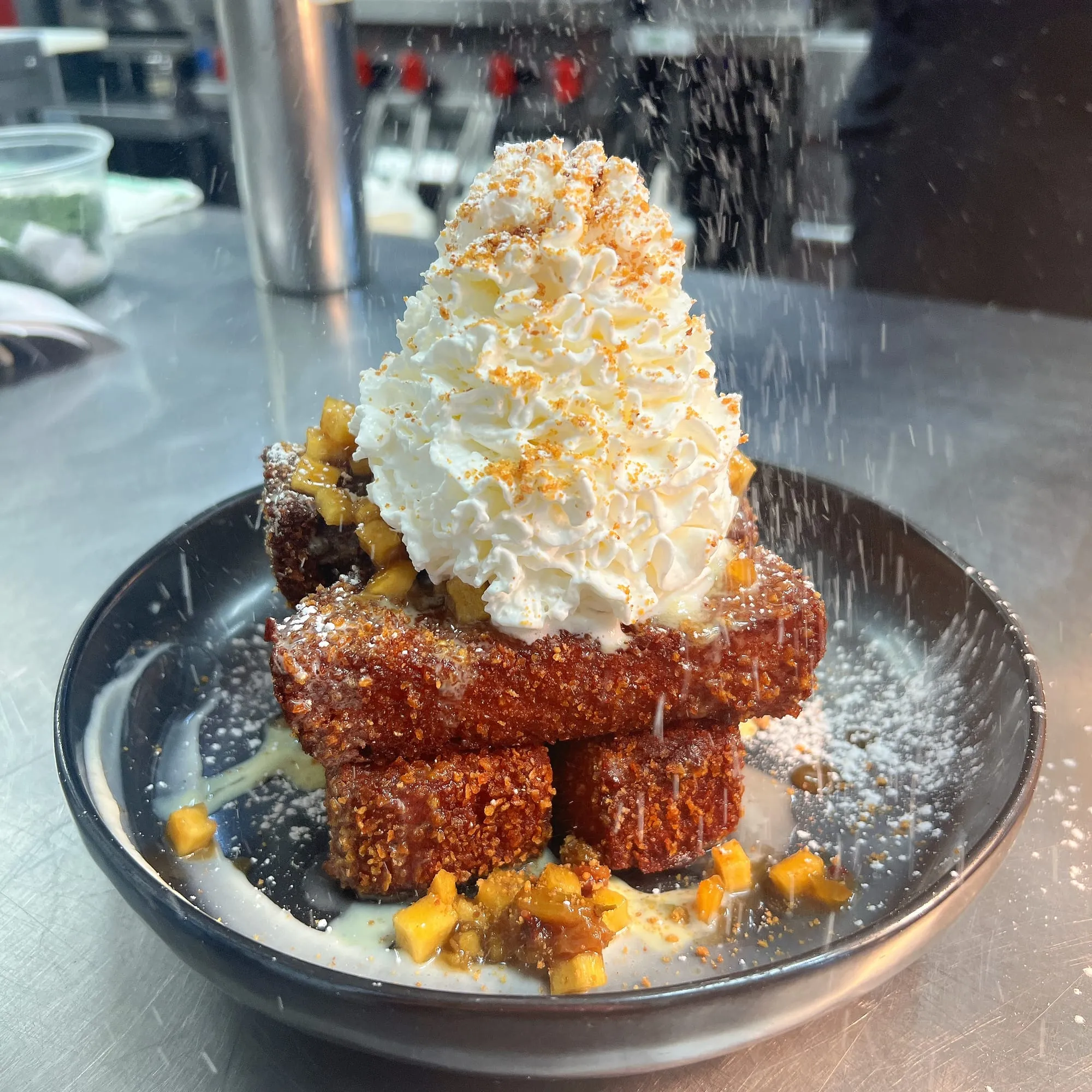 French toast sticks stacked with whipped cream