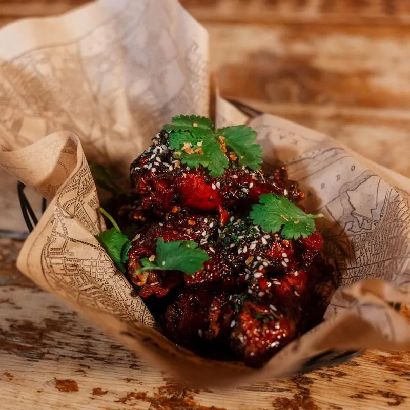 Sticky Korean BBQ wings with sesame and cilantro