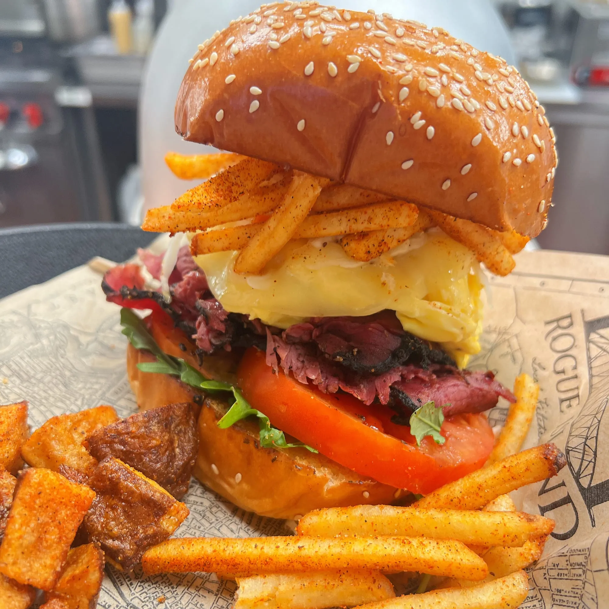 Primanti-style pastrami sandwich stacked with fries